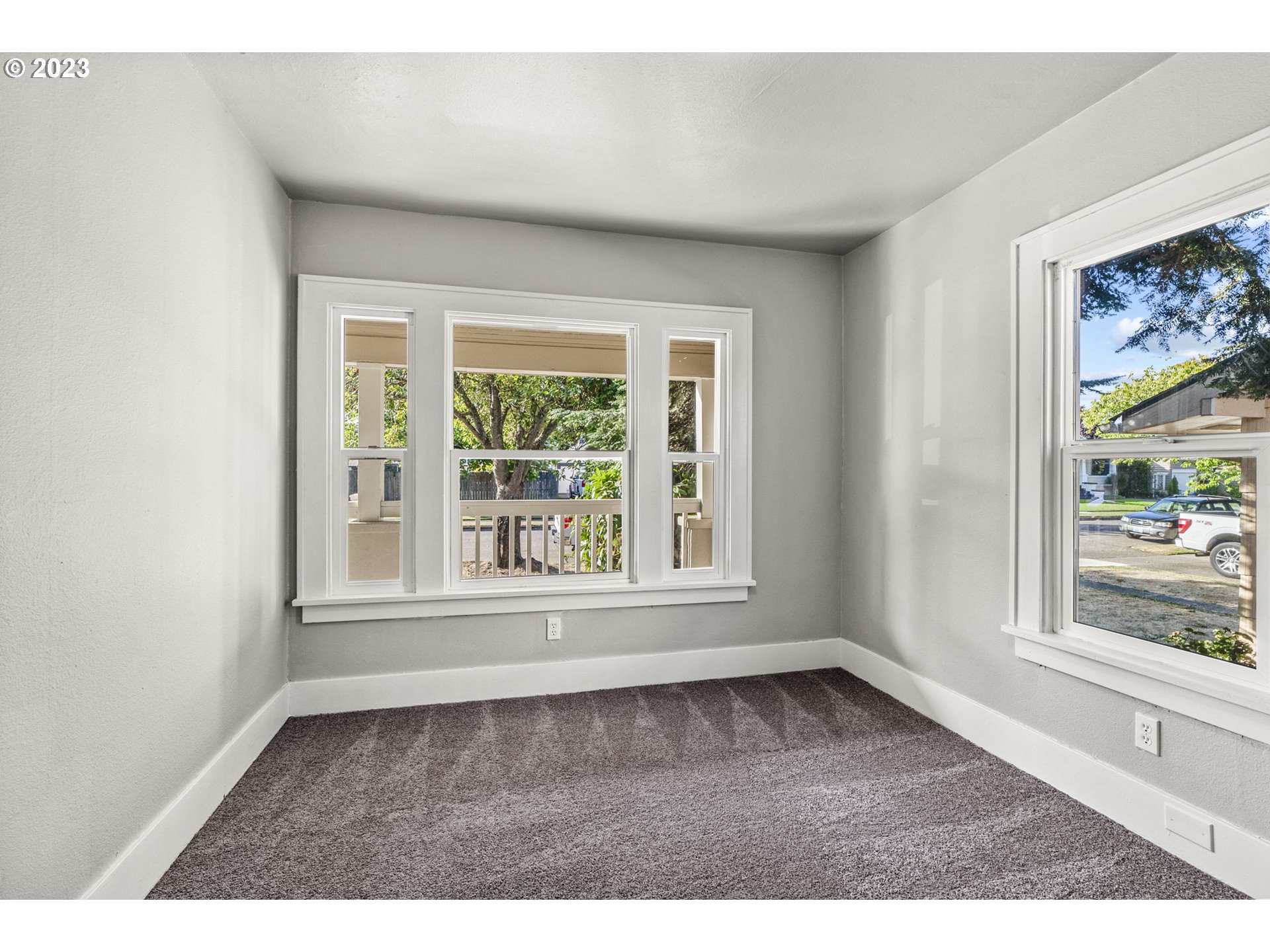 2808 Florida Street Longview, WA 98632 - Photo 9 of 20 an empty room with wooden floor and windows