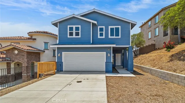 a front view of a house with a garage
