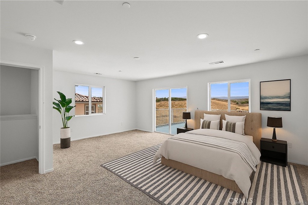 13105 Via Tuscany Riverside, CA 92503 - Photo 11 of 51 a bedroom with a large bed a potted plant and attached window