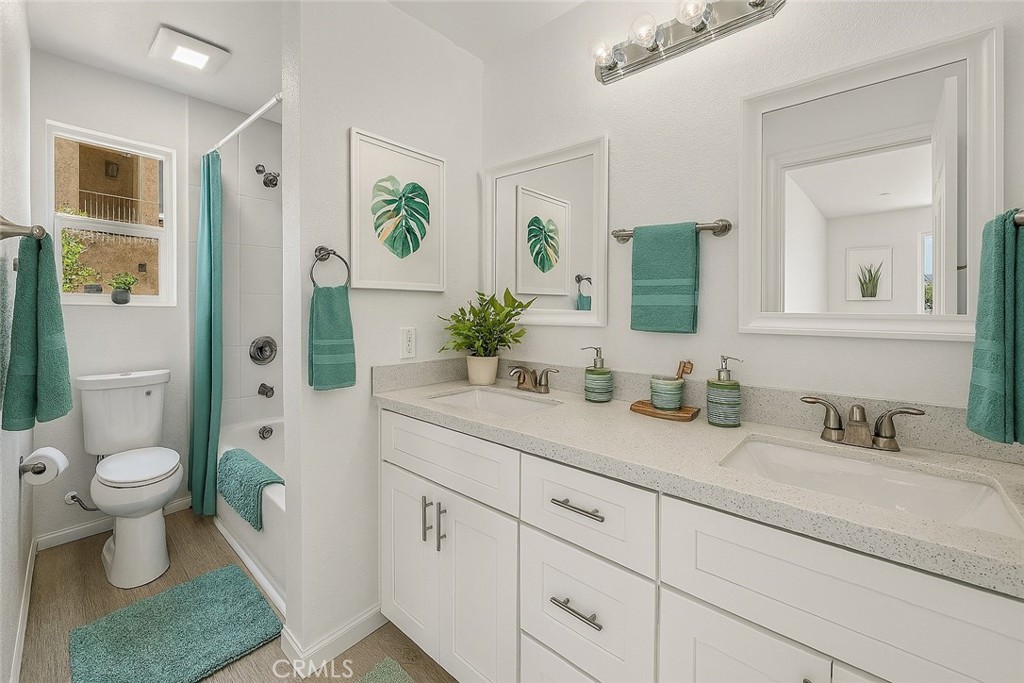 13105 Via Tuscany Riverside, CA 92503 - Photo 12 of 51 a bathroom with a toilet sink and mirror