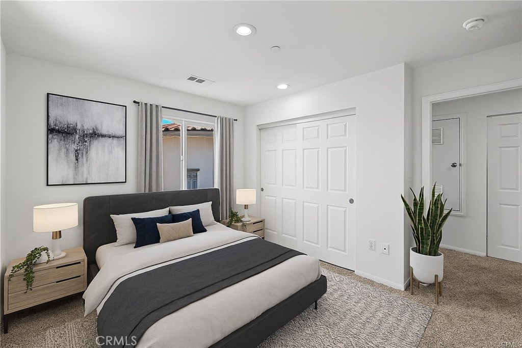 13105 Via Tuscany Riverside, CA 92503 - Photo 15 of 51 a bedroom with a bed and a potted plant