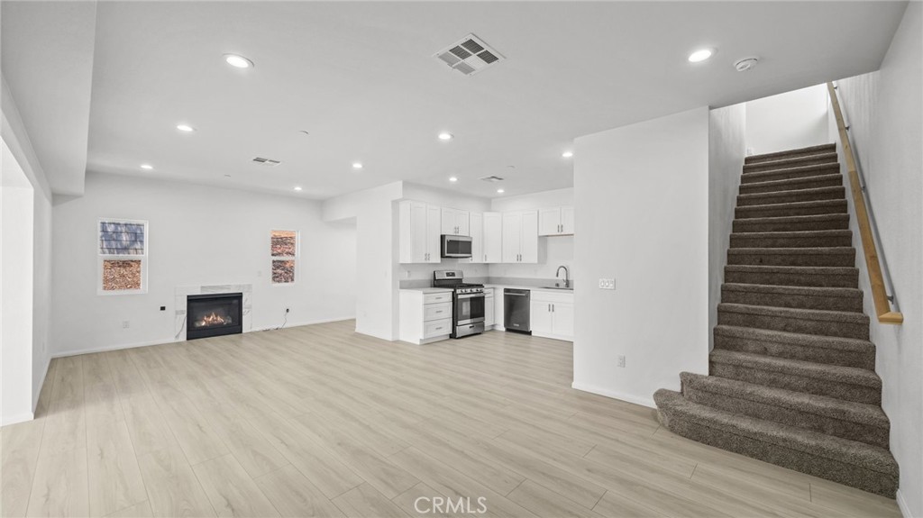 13105 Via Tuscany Riverside, CA 92503 - Photo 19 of 51 a view of a kitchen with stairs and an empty room