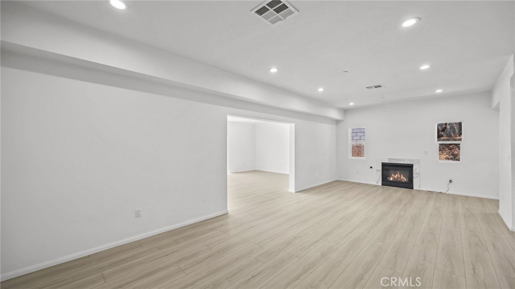 13105 Via Tuscany Riverside, CA 92503 - Photo 25 of 51 a view of an empty room with wooden floor