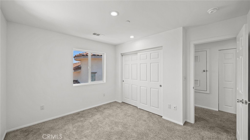13105 Via Tuscany Riverside, CA 92503 - Photo 41 of 51 en empty room with windows