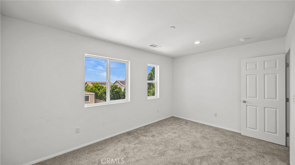 13105 Via Tuscany Riverside, CA 92503 - Photo 44 of 51 an empty room with windows