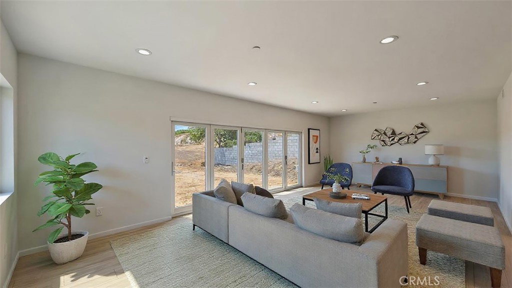 13105 Via Tuscany Riverside, CA 92503 - Photo 5 of 51 a living room with furniture and a potted plant