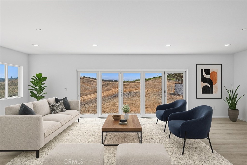 13105 Via Tuscany Riverside, CA 92503 - Photo 6 of 51 a living room with furniture and a large window