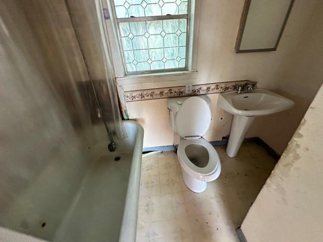 202 Mill Street Valley View, TX 76272 - Photo 20 of 22 a bathroom with a sink and a mirror