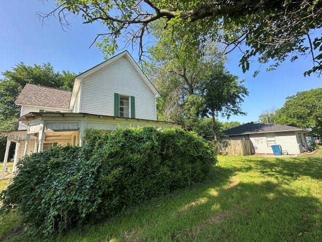 202 Mill Street Valley View, TX 76272 - Photo 2 of 22 a house view with a garden space