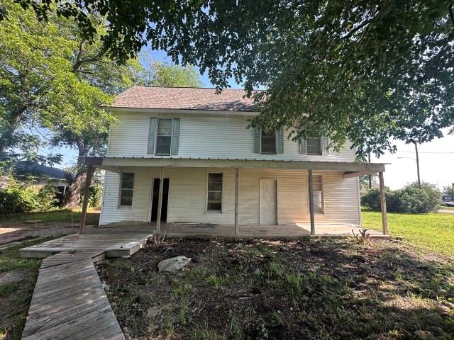 202 Mill Street Valley View, TX 76272 - Photo 3 of 22 a front view of a house with a yard