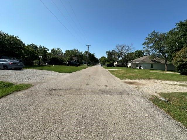 202 Mill Street Valley View, TX 76272 - Photo 4 of 22 a view of a field with a trees in the background