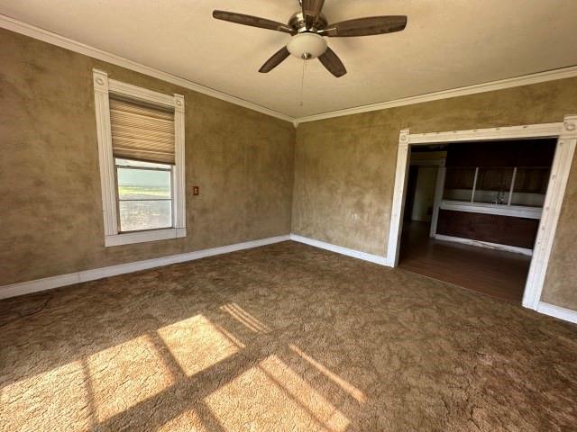 202 Mill Street Valley View, TX 76272 - Photo 7 of 22 a view of empty room with wooden floor and fan