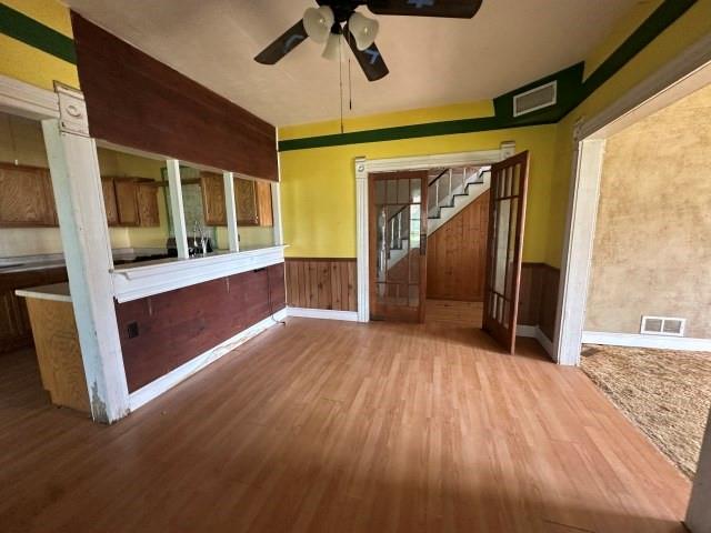 202 Mill Street Valley View, TX 76272 - Photo 8 of 22 a view of empty room with wooden floor and fan