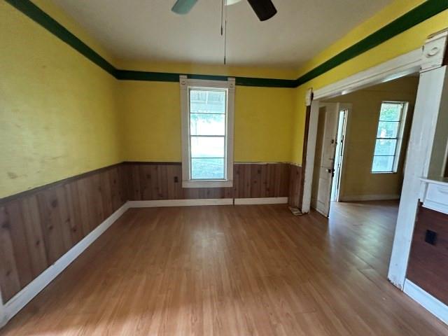 202 Mill Street Valley View, TX 76272 - Photo 10 of 22 wooden floor in an empty room with a window