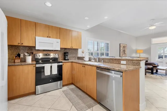 a spacious bedroom with a bed a table and a large window