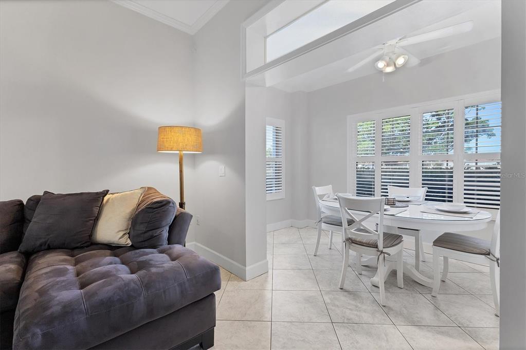 3605 54th Drive West, Unit 104 Bradenton, FL 34210 - Photo 16 of 65 a living room with furniture and a large window