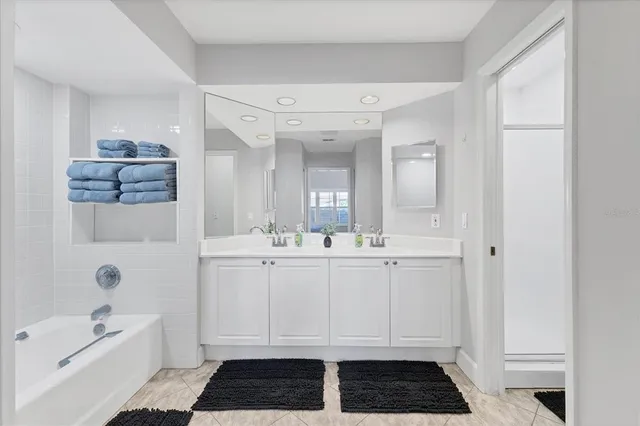 a bathroom with a sink and mirror