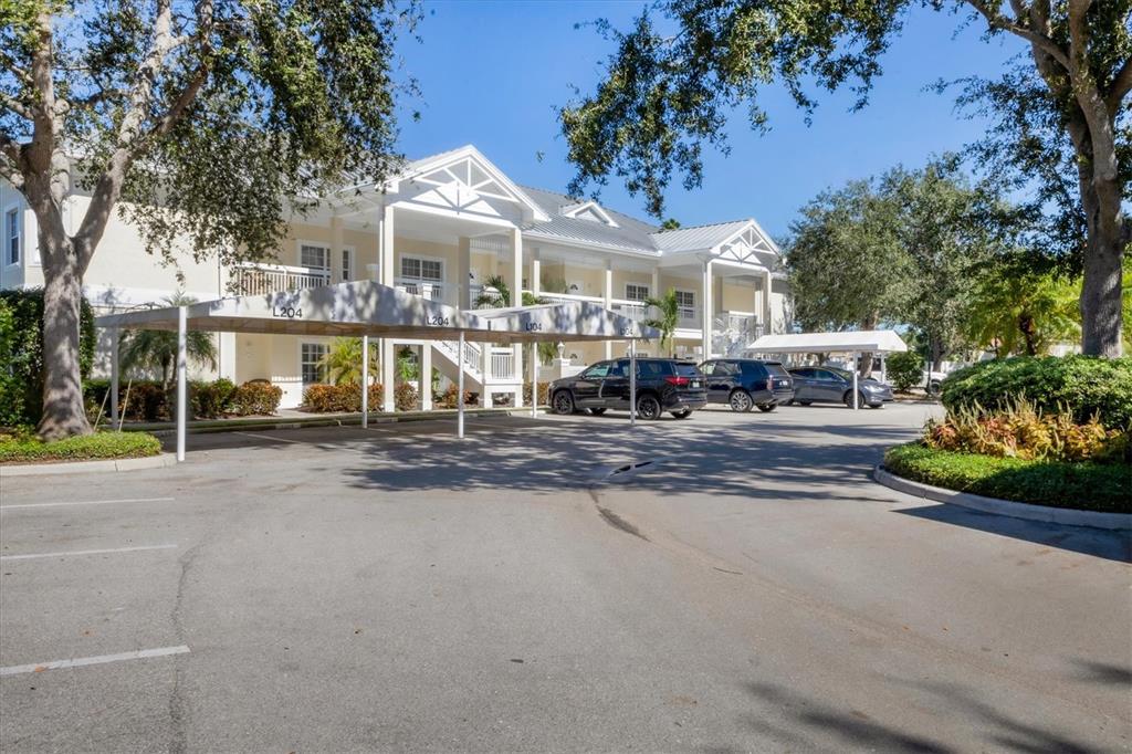 3605 54th Drive West, Unit 104 Bradenton, FL 34210 - Photo 2 of 65 a view of multiple houses with a street