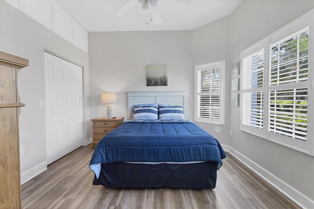 3605 54th Drive West, Unit 104 Bradenton, FL 34210 - Photo 22 of 65 a bedroom with a bed and window