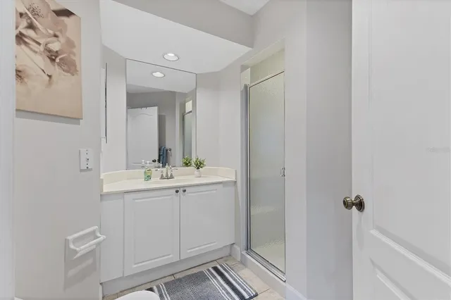 an aerial view of residential houses with outdoor space and ocean view