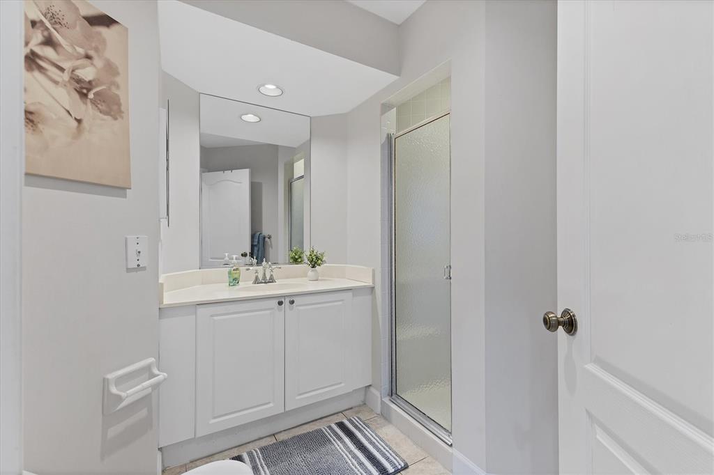 3605 54th Drive West, Unit 104 Bradenton, FL 34210 - Photo 27 of 65 a bathroom with a sink and mirror