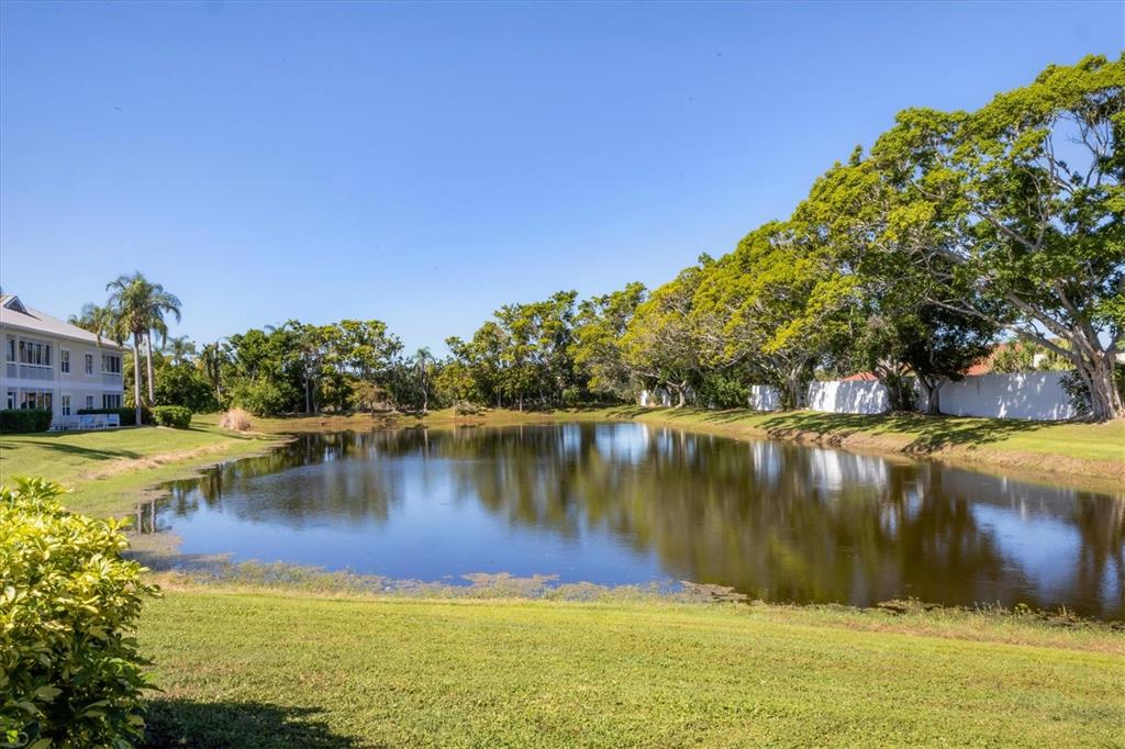 3605 54th Drive West, Unit 104 Bradenton, FL 34210 - Photo 32 of 65 a view of a lake with houses