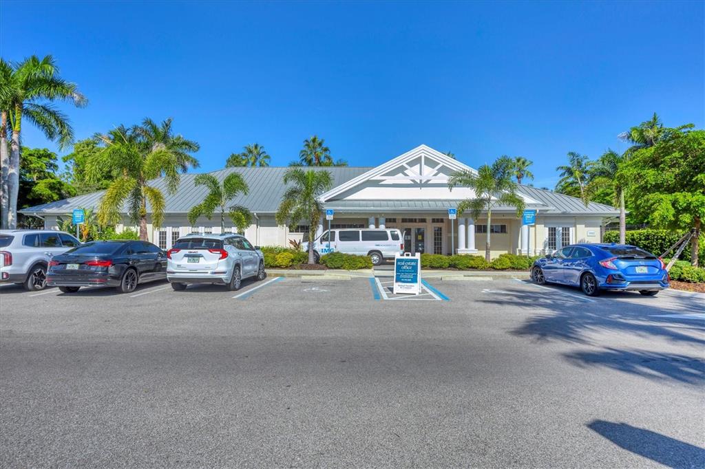 3605 54th Drive West, Unit 104 Bradenton, FL 34210 - Photo 39 of 65 a view of a cars parked in front of a house