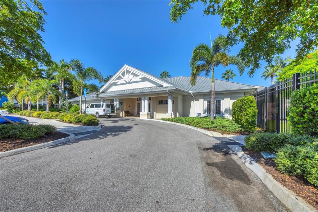 3605 54th Drive West, Unit 104 Bradenton, FL 34210 - Photo 40 of 65 a front view of a house with garden