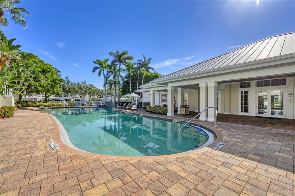 3605 54th Drive West, Unit 104 Bradenton, FL 34210 - Photo 43 of 65 a view of a house with swimming pool and sitting area