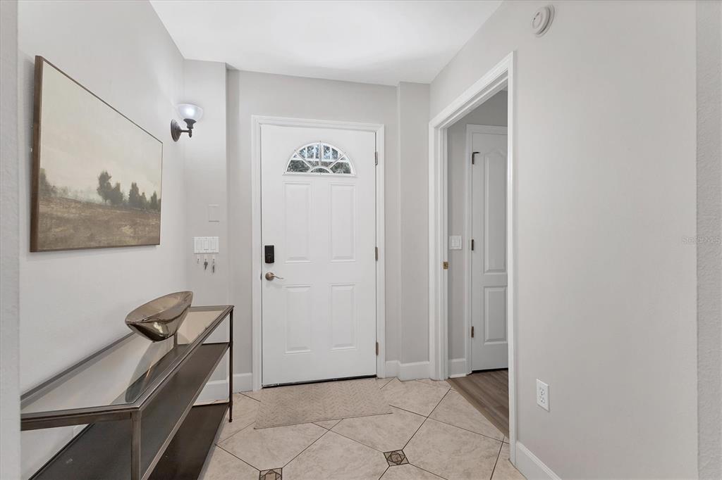 3605 54th Drive West, Unit 104 Bradenton, FL 34210 - Photo 5 of 65 a view of a hallway with workspace