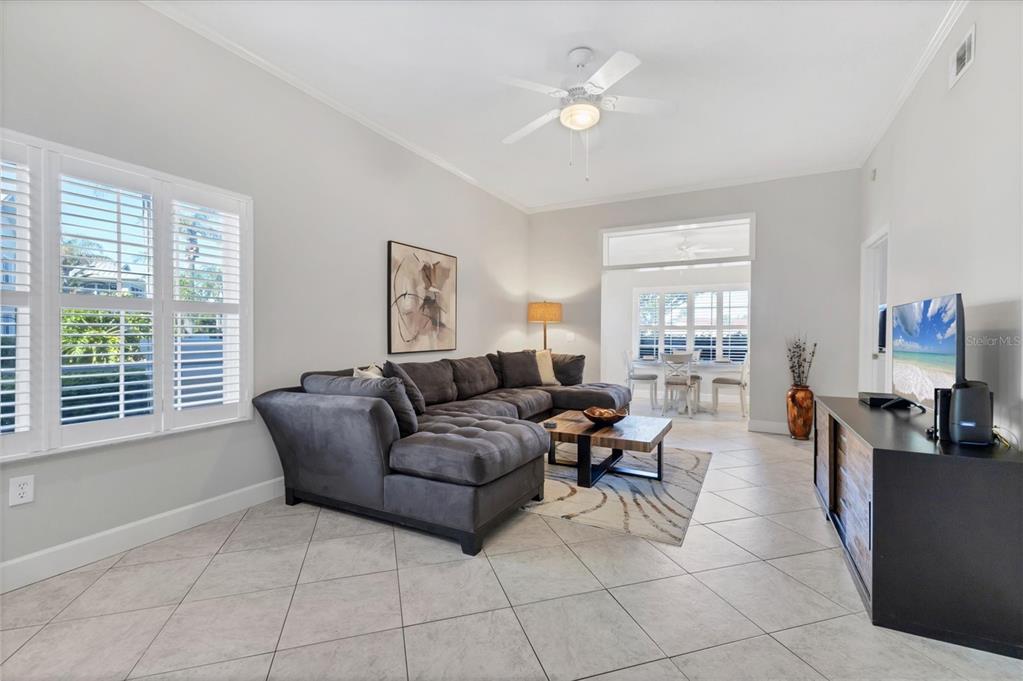3605 54th Drive West, Unit 104 Bradenton, FL 34210 - Photo 6 of 65 a living room with furniture and a window