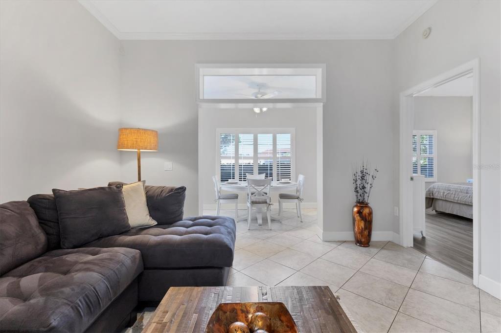 3605 54th Drive West, Unit 104 Bradenton, FL 34210 - Photo 8 of 65 a living room with furniture and a window