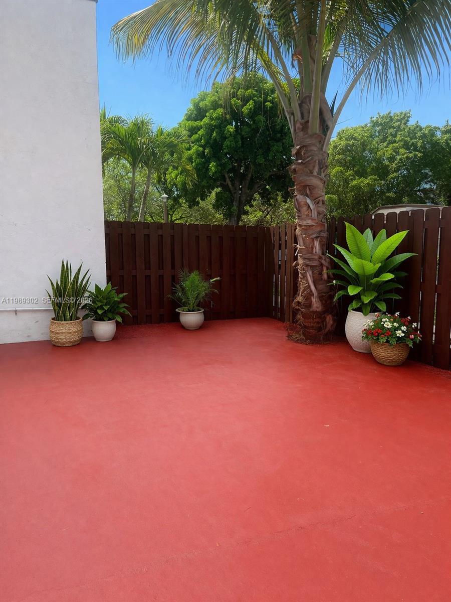 441 Northwest 98th Court, Unit 441 Miami, FL 33172 - Photo 15 of 18 a backyard of a house with lots of green space