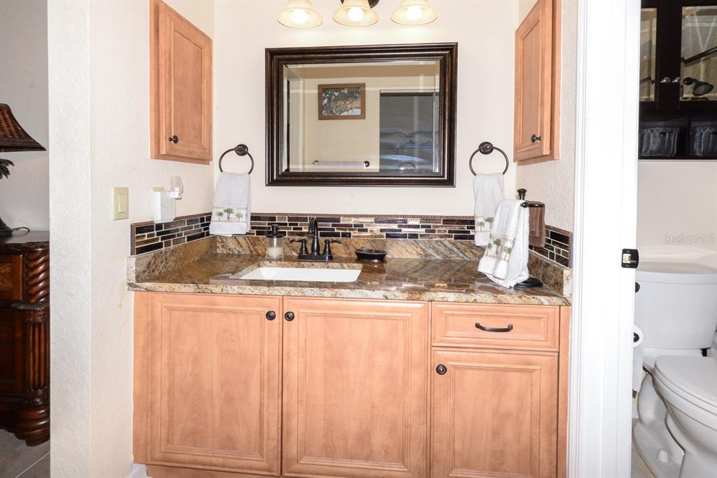 335 Coldeway Drive, Unit F21 Punta Gorda, FL 33950 - Photo 29 of 45 a bathroom with a double vanity sink and a mirror