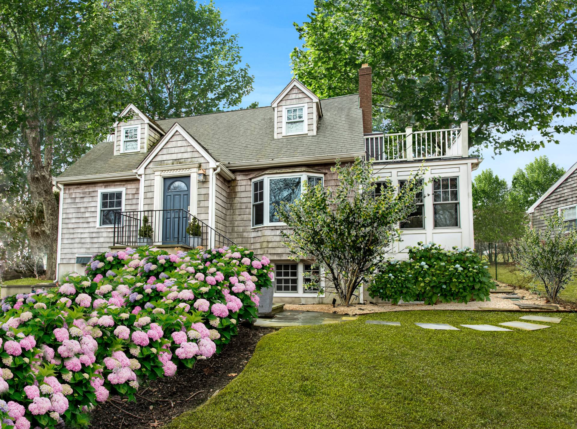 3752 Noyack Road Sag Harbor, NY 11963 - Photo 2 of 28 front view of a house with a yard