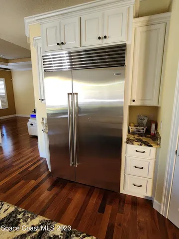 a kitchen with appliances and cabinets