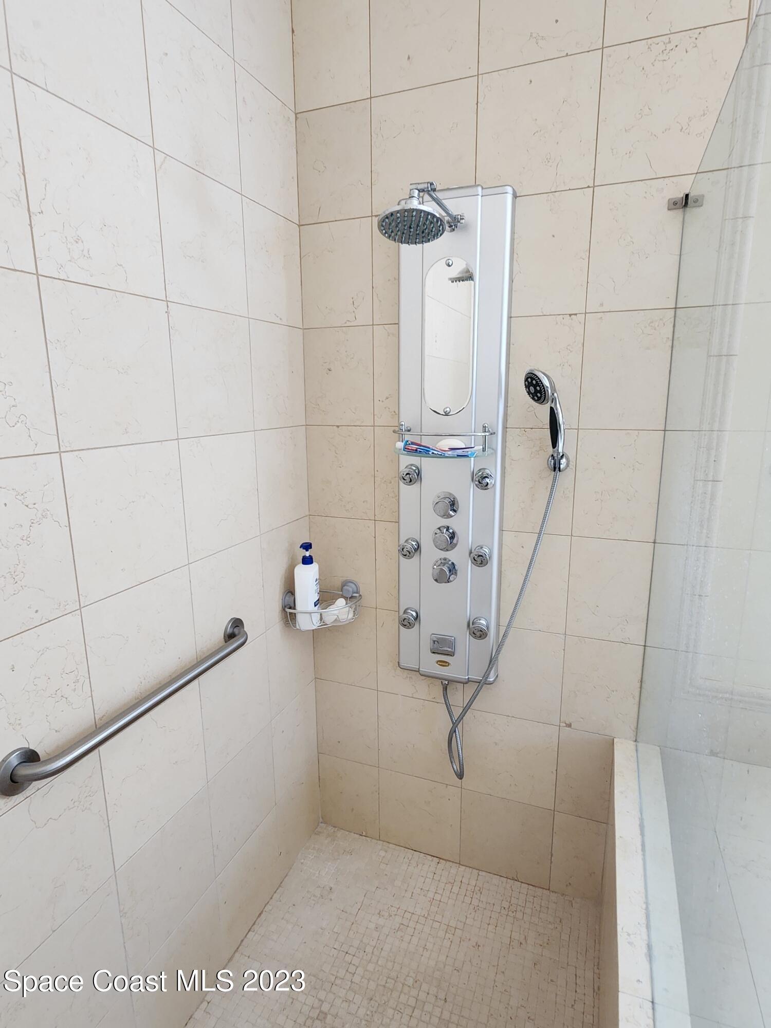 4124 Waterloo Place Melbourne, FL 32940 - Photo 18 of 32 a bathroom with a shower