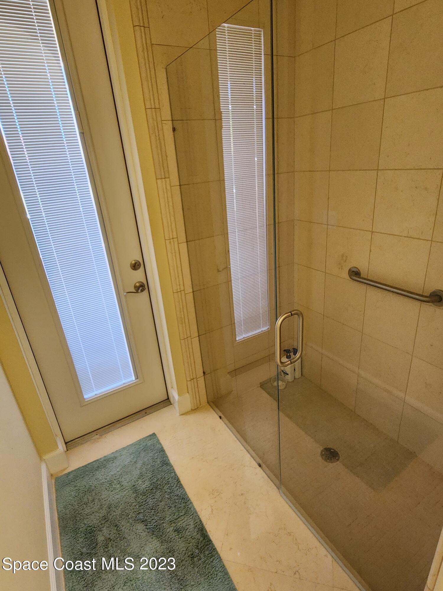 4124 Waterloo Place Melbourne, FL 32940 - Photo 20 of 32 a bathroom with a shower