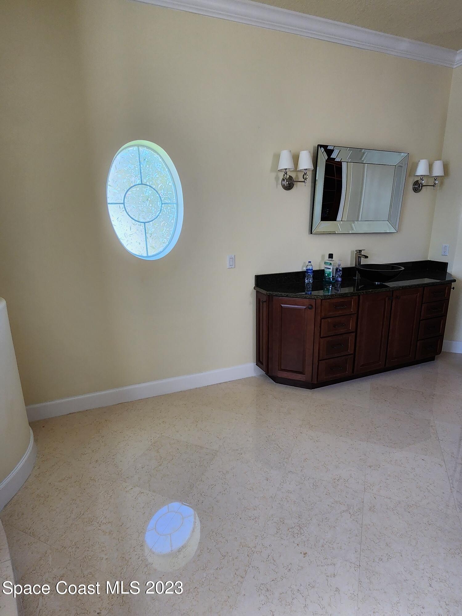 4124 Waterloo Place Melbourne, FL 32940 - Photo 25 of 32 a room with a cabinet