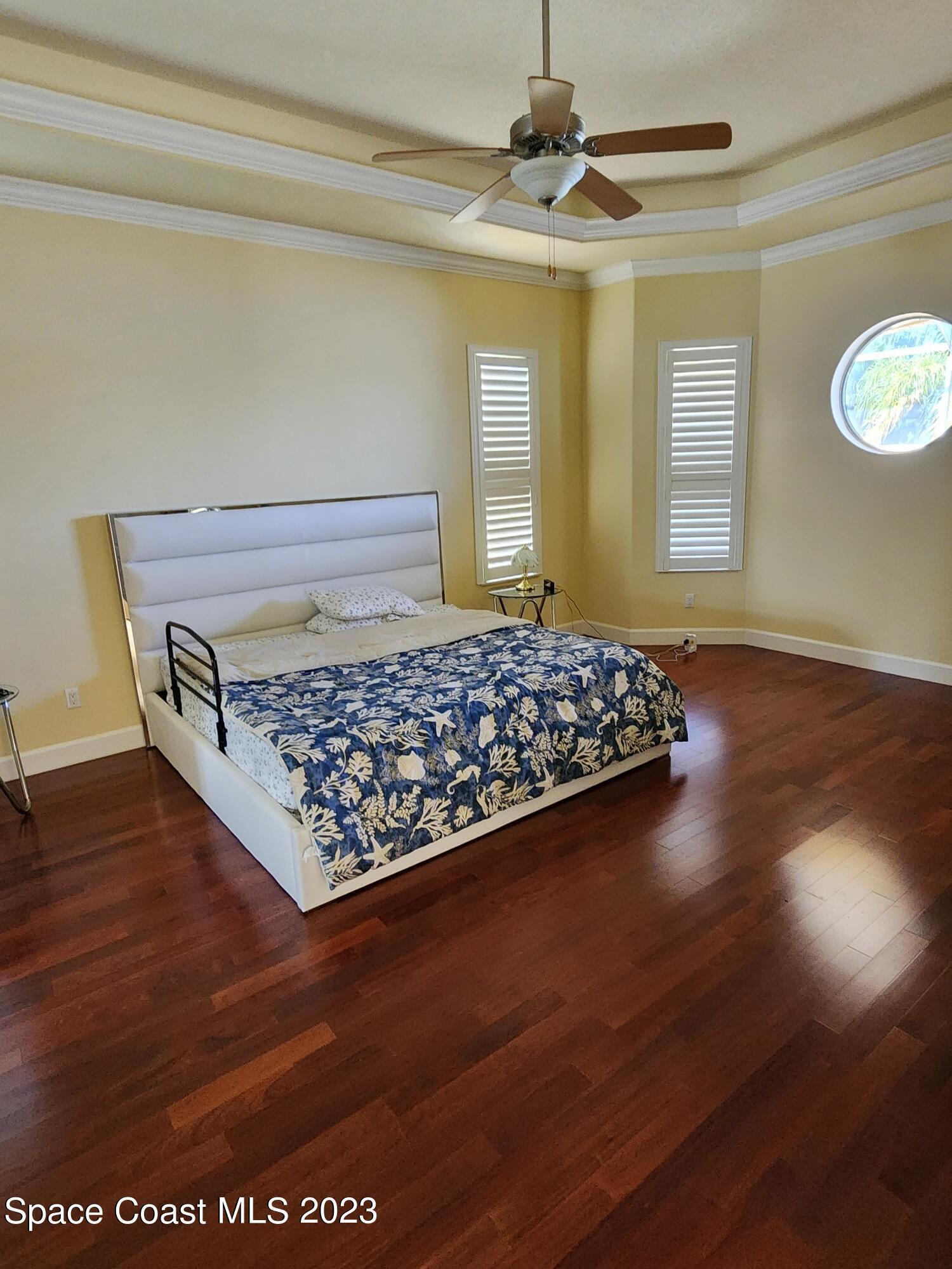 4124 Waterloo Place Melbourne, FL 32940 - Photo 27 of 32 a living room with hard wood floors and a fireplace
