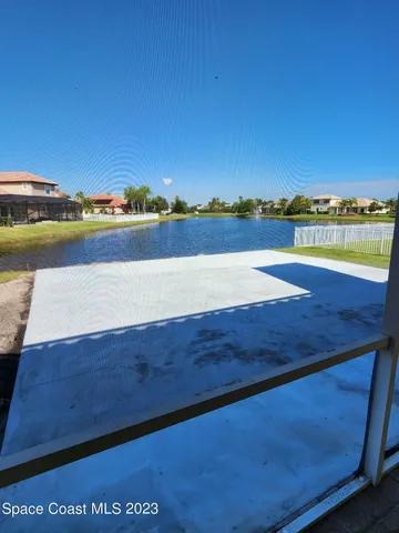 a view of swimming pool with outdoor space and lake view