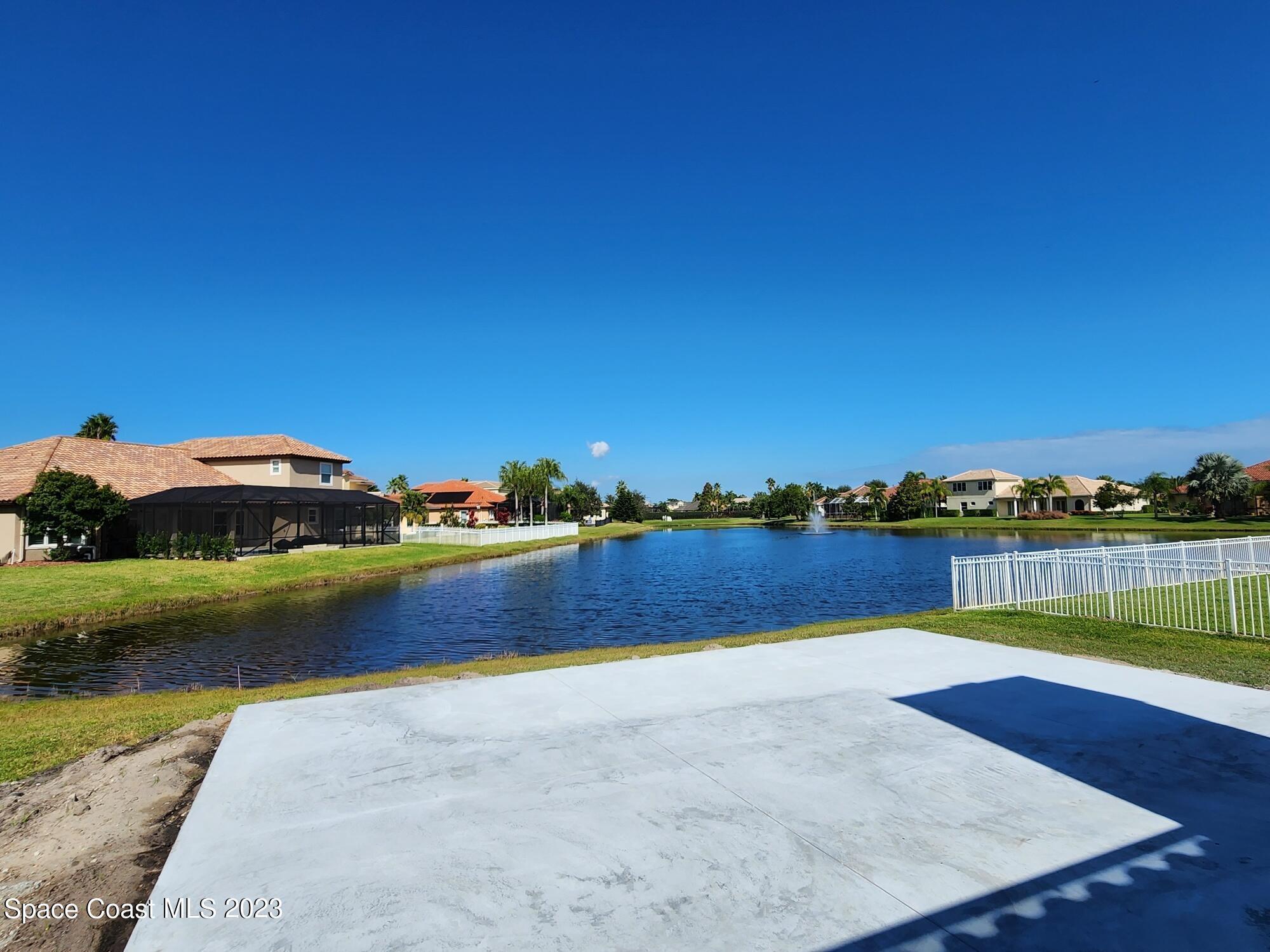 4124 Waterloo Place Melbourne, FL 32940 - Photo 31 of 32 a view of swimming pool with outdoor space and lake view