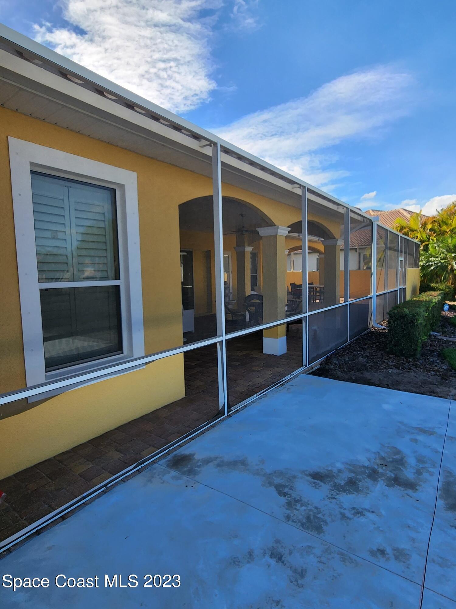 4124 Waterloo Place Melbourne, FL 32940 - Photo 32 of 32 a view of an empty room with wooden floor and fence