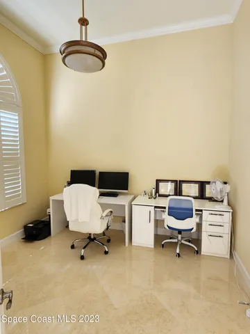 a bedroom with a workspace