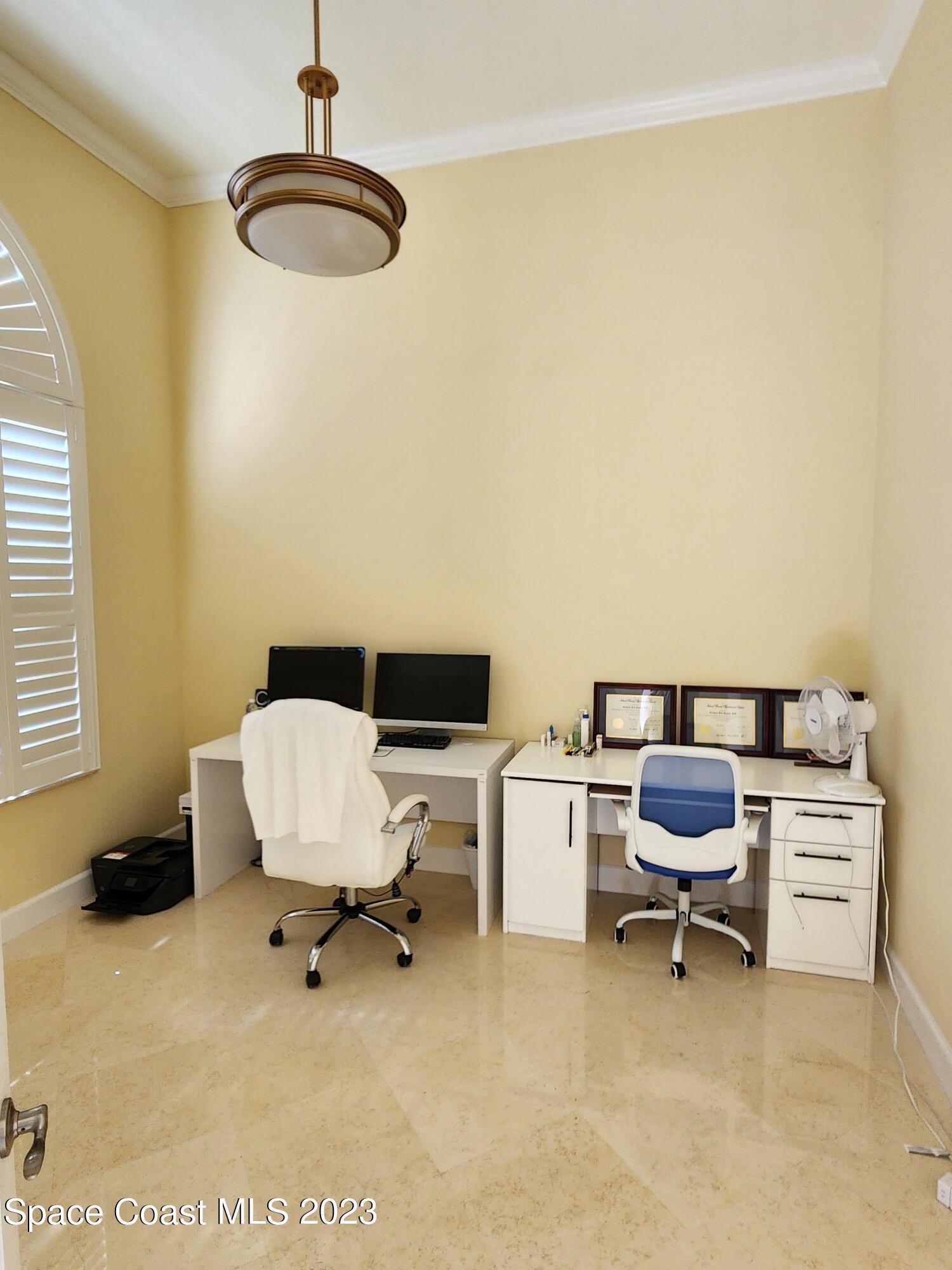 4124 Waterloo Place Melbourne, FL 32940 - Photo 7 of 32 a bedroom with a workspace