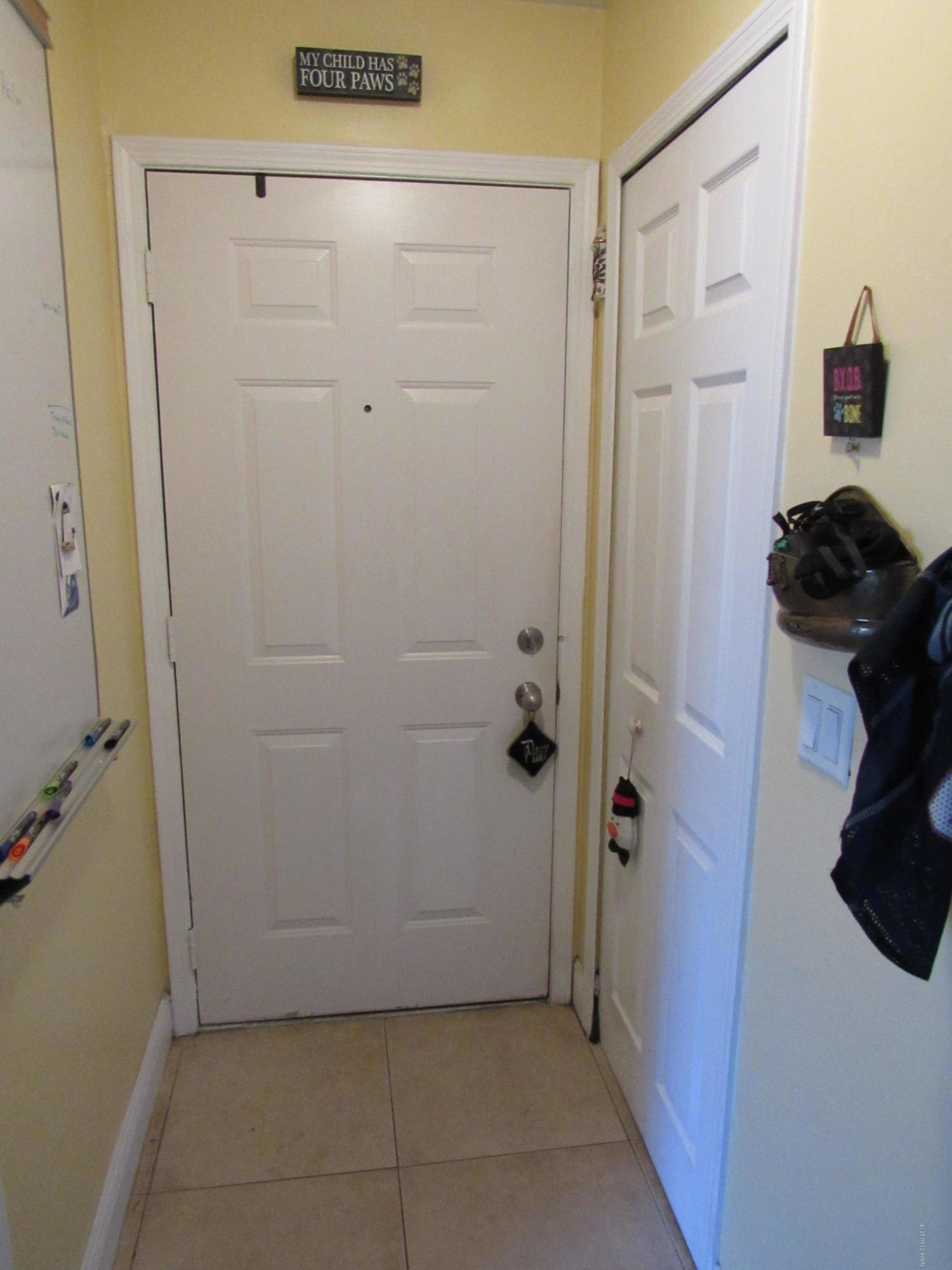 7667 North Wickham Road, Unit 111 Melbourne, FL 32940 - Photo 13 of 21 Front door Hall way