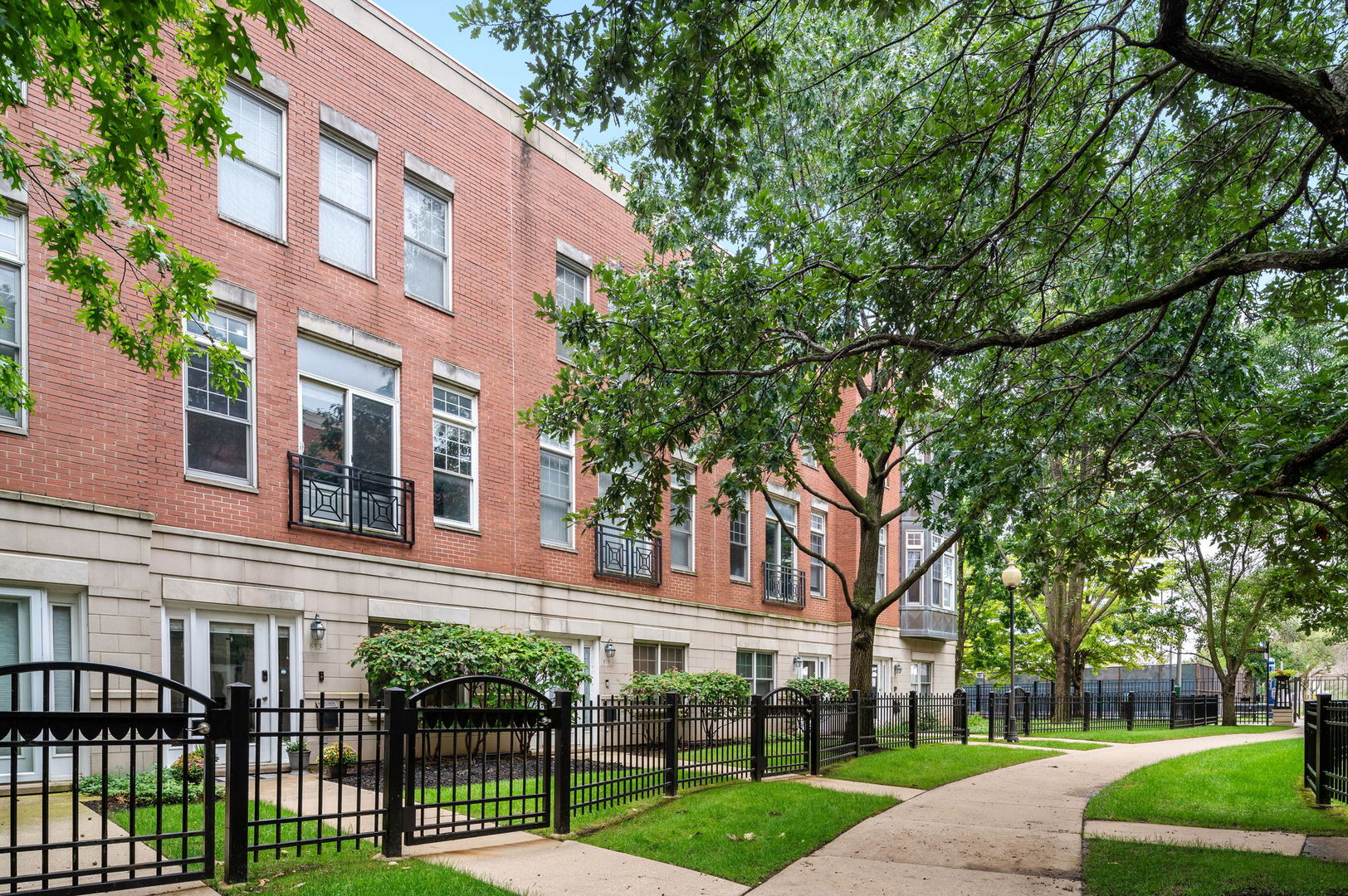 813 West University Lane Chicago, IL 60608 - Photo 1 of 33 a view of a building with a yard