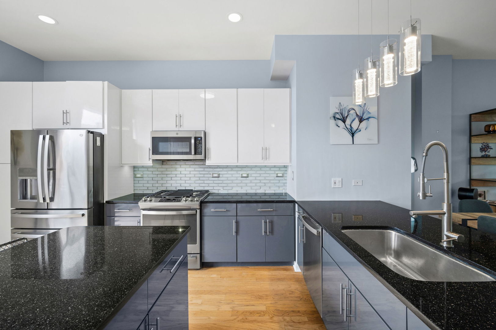 813 West University Lane Chicago, IL 60608 - Photo 14 of 33 a kitchen with stainless steel appliances granite countertop a sink stove and refrigerator