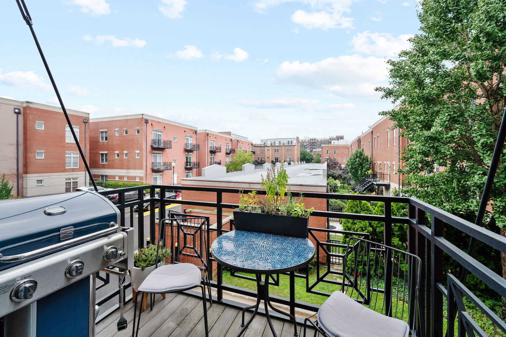 813 West University Lane Chicago, IL 60608 - Photo 17 of 33 a balcony with a table and chairs