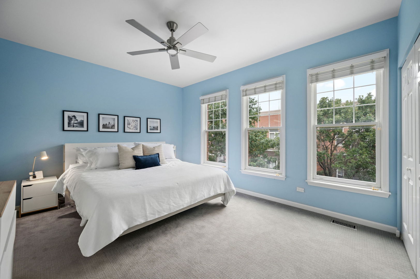 813 West University Lane Chicago, IL 60608 - Photo 18 of 33 a bedroom with a large bed and a large window